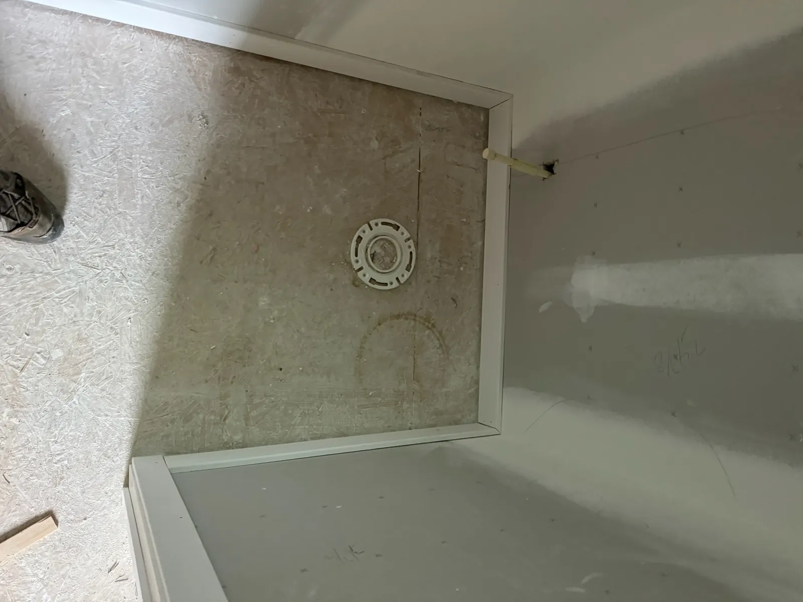 Bathroom renovation in progress with the tub surround being installed