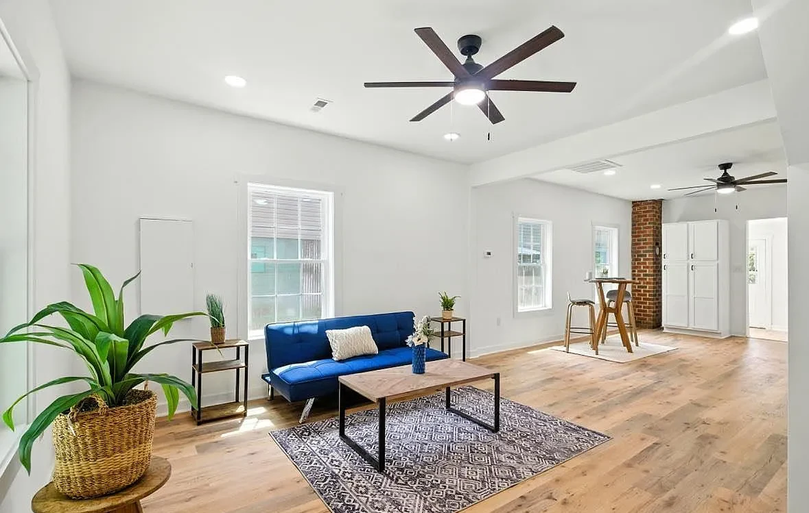 Completed Bransford Street main living area with finished floors and recessed lighting