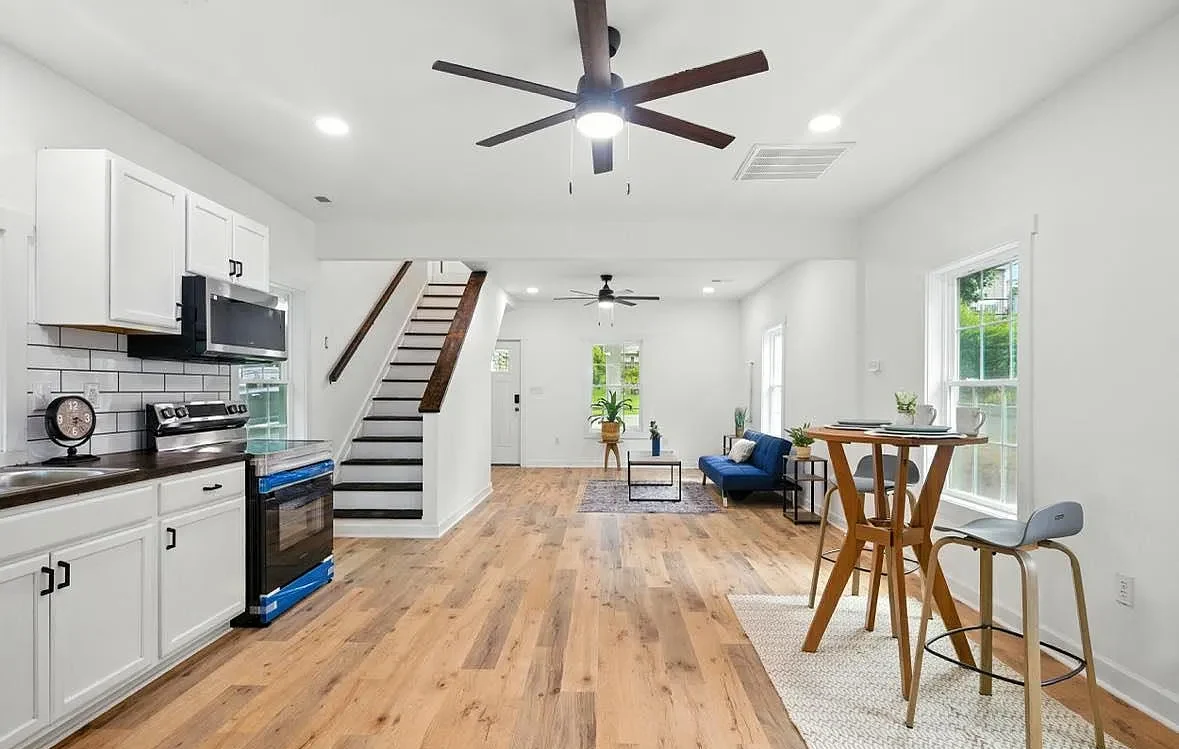 Completed Bransford Street kitchen with white cabinetry and stainless appliances