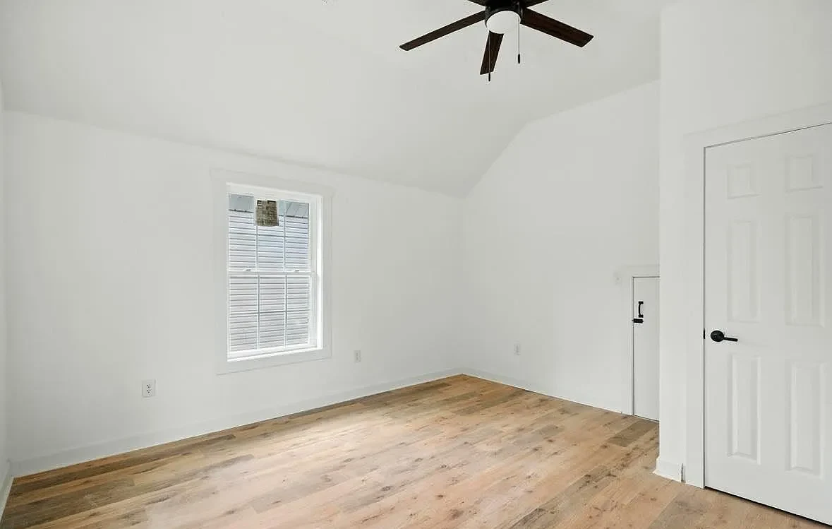 Completed Bransford Street bedroom with finished walls and hardwood floor