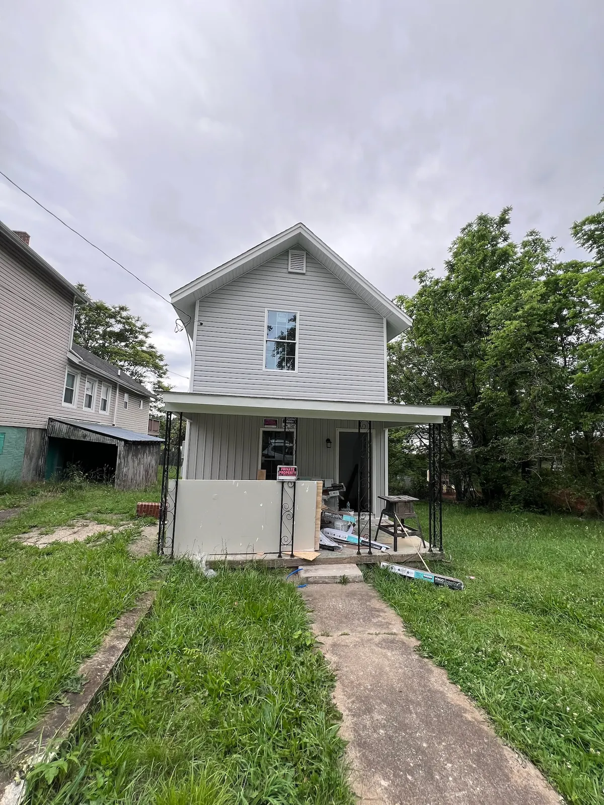 Bransford Street exterior during siding and porch construction