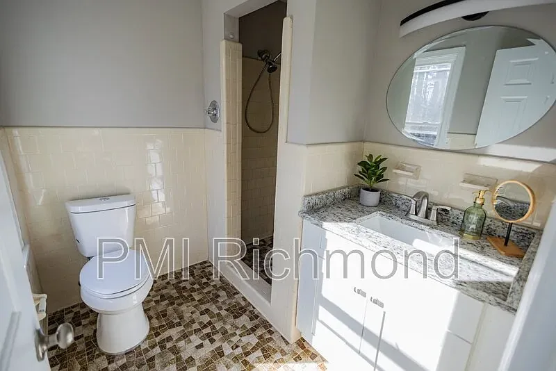 Renovated Kingsland Rd hall bathroom with new tile and vanity