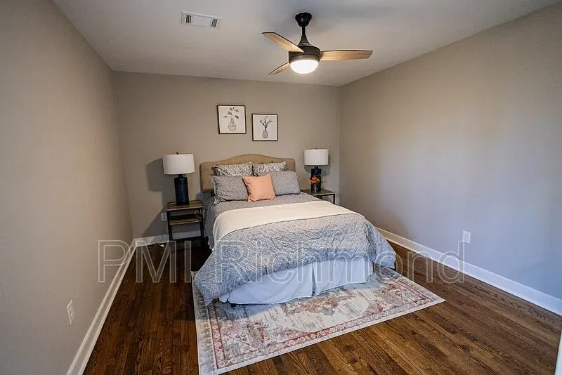 Completed bedroom at Kingsland Rd with refinished hardwood floors