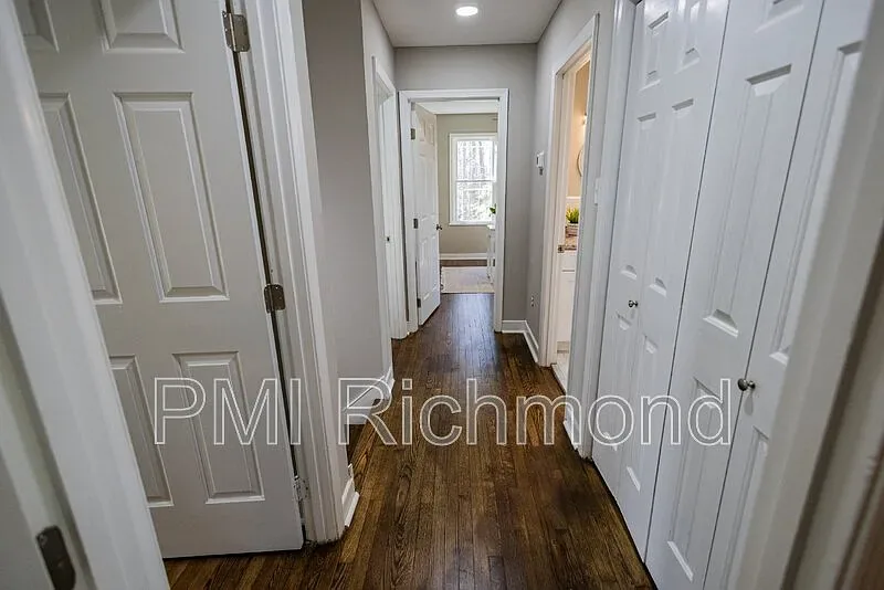 Completed hallway at Kingsland Rd with refinished floors and closets